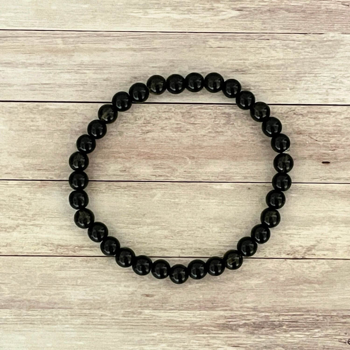 Vue de dessus du bracelet Ancrage profond en Onyx Tourmaline Noire et Quartz Fumé