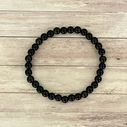 Vue de dessus du bracelet Ancrage profond en Onyx Tourmaline Noire et Quartz Fumé